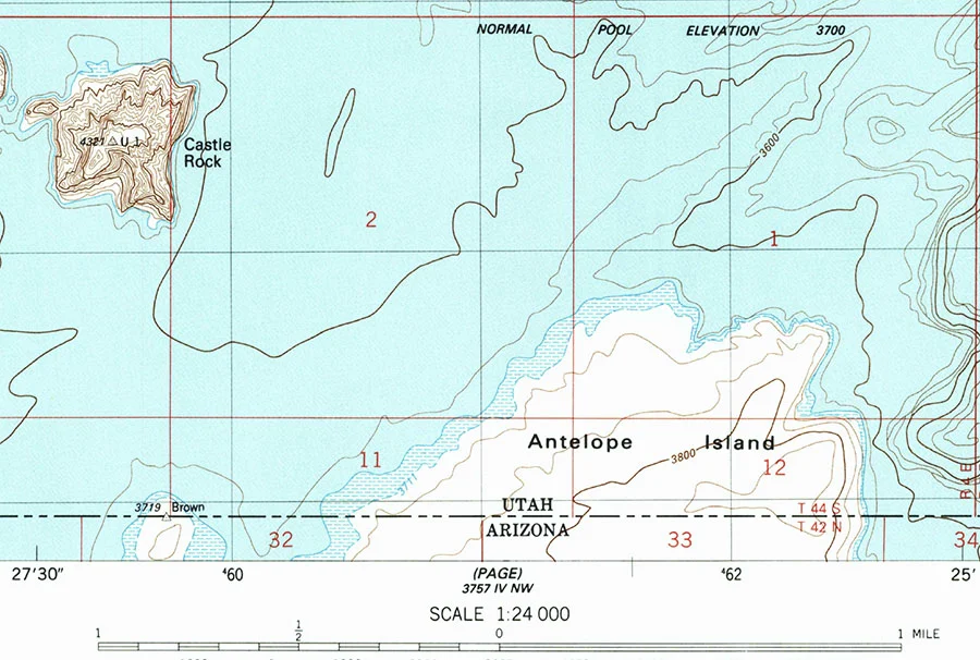 The 1934 border monument named Brown appears on a peninsula, surrounded by water, on the USGS map.