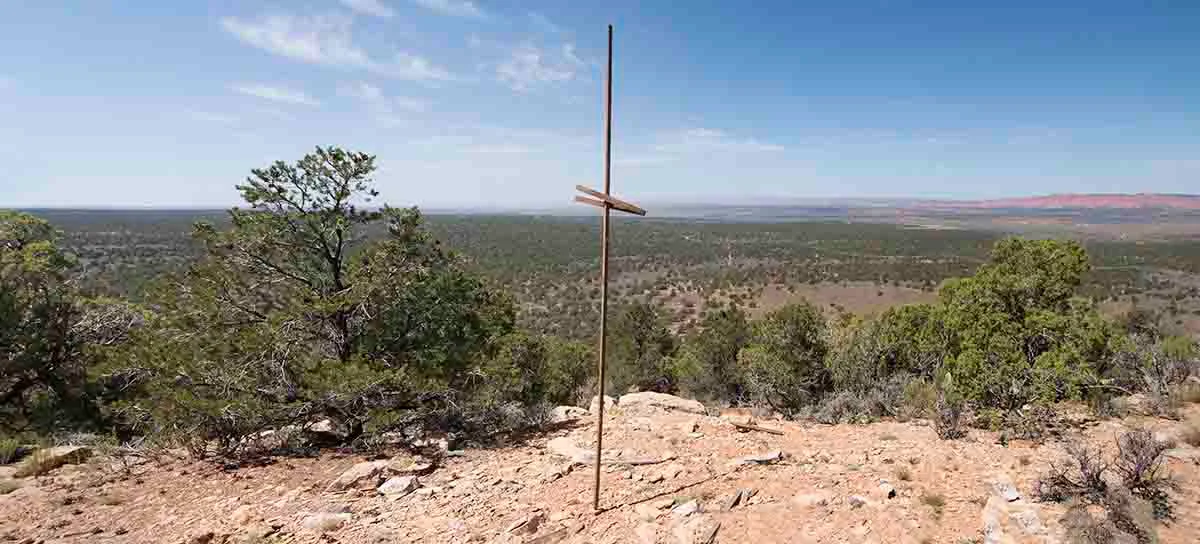Survey pole near AZ-UT Mile 104 at 112˚ 9’ West Longitude